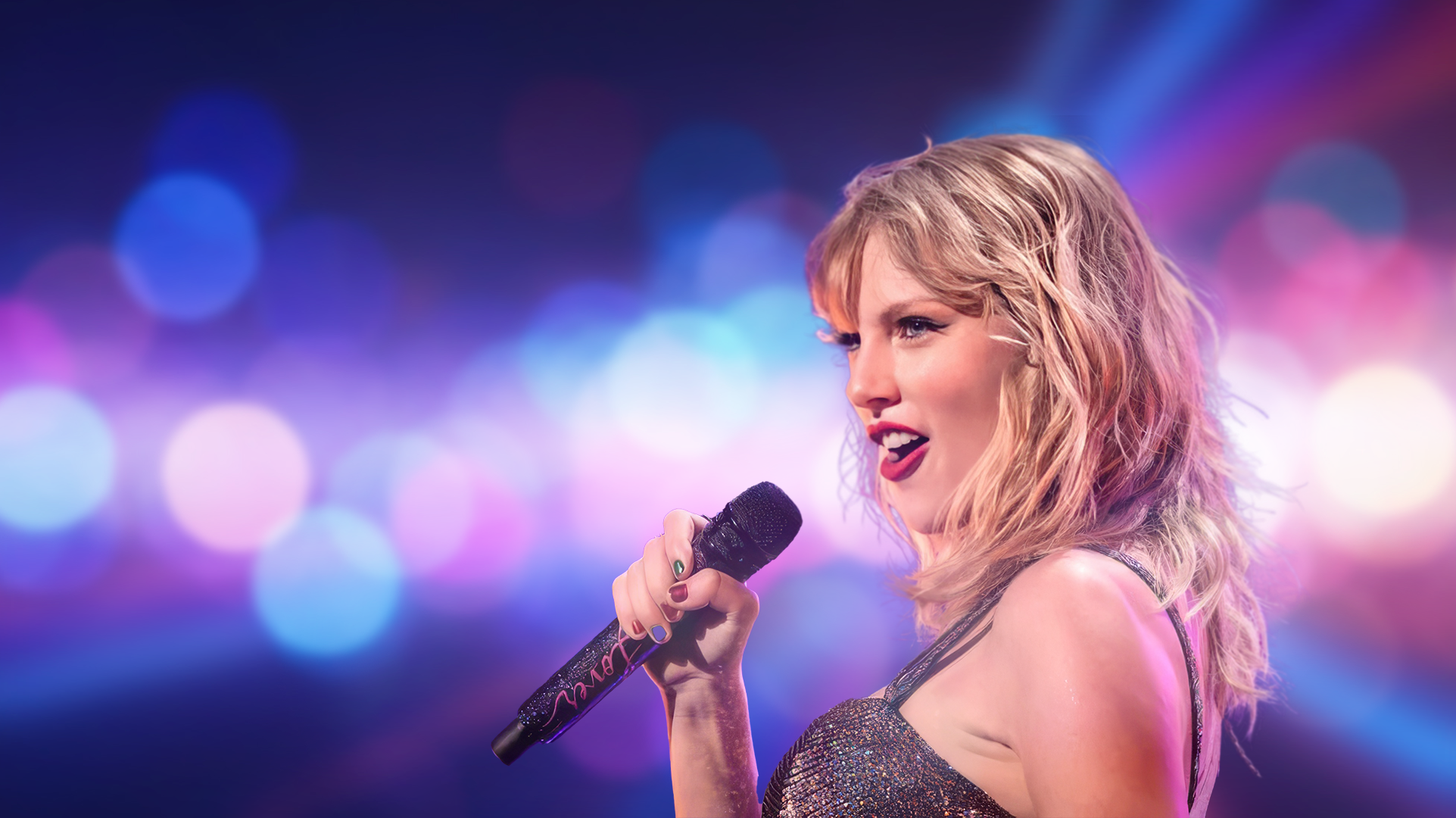 Pop superstar singing into a microphone under stage lights at a Howell XR-produced show